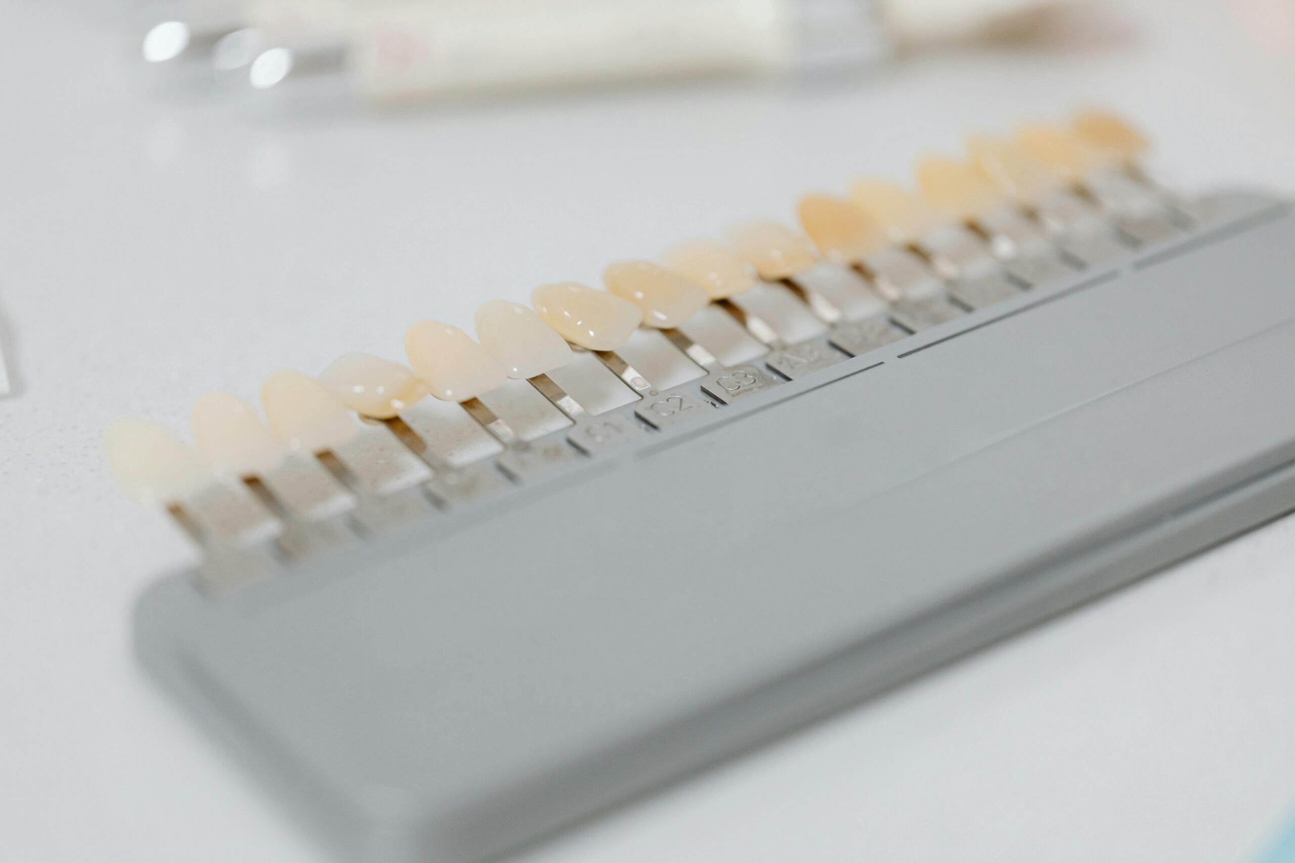 Close-up image of a dental shade guide displaying various tooth color options.